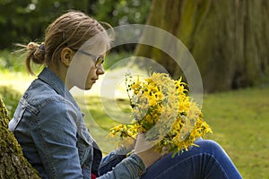 Smiling girl with big bouquet