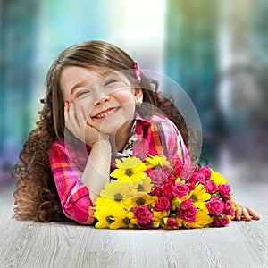 Smiling girl with big bouquet of flowers