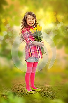 Smiling girl with big bouquet of flowers