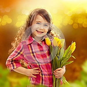 Smiling girl with big bouquet of flowers