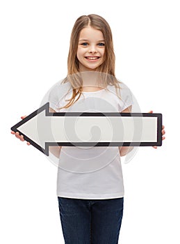 Smiling girl with blank arrow pointing left