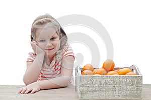 Smiling girl with a box of mandarins over white background