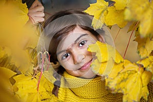 Smiling girl with braids in autumn