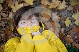 Smiling girl with braids in autumn