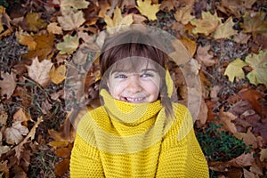 Smiling girl with braids in autumn