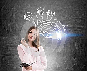 Smiling girl and brain with light bulbs