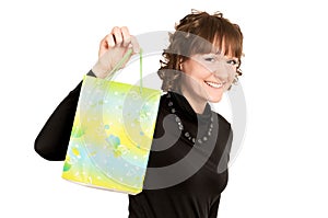 Smiling girl buyer with present bag