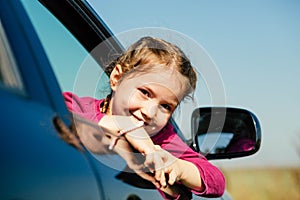 Smiling girl in the car