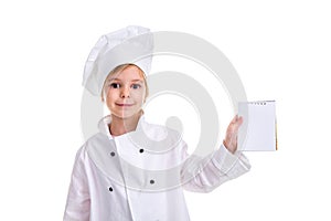 Smiling girl chef white uniform isolated on white background. Holding and showing the empty note, looking at the camera