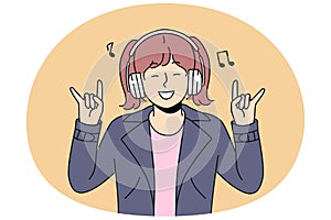 Smiling girl child listen to rock music in earphones