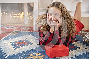 Smiling girl with christmas gift box