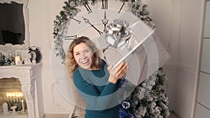 Smiling girl with Christmas gifts