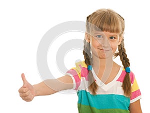 Smiling girl demonstrates thumb up