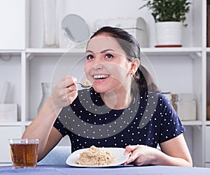 Smiling girl eating cereal