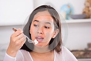 Smiling girl eating tasty sala