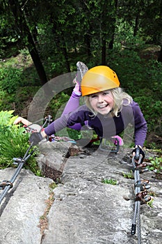 Smiling girl enjoy climbing