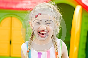 Smiling girl with facepainting