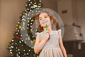 Smiling girl in festife dress at New year celebration