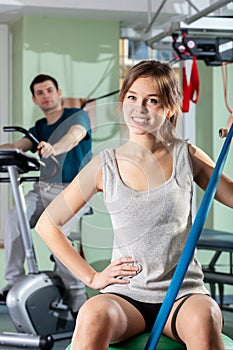 Smiling girl in fitness center