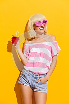 Smiling girl with fresh red drink