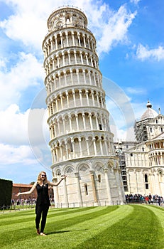 Smiling girl in front of the leaning tower of Pisa Italy