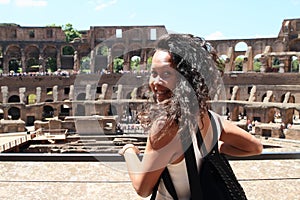 Smiling girl on gallery of Colosseum