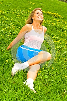 Smiling girl on the grass