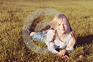 Smiling girl in grass