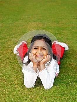 Smiling girl on grass