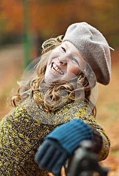 Smiling girl in grey beret