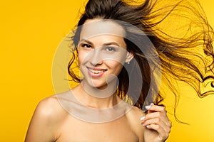 Smiling girl hair flying wind haircare health