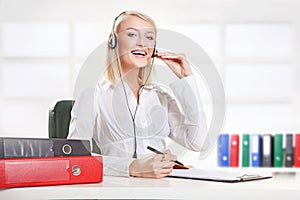 Smiling girl with headset phone