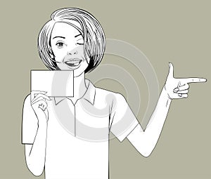 Smiling girl holding blank sheet in hand winking and pointing with finger