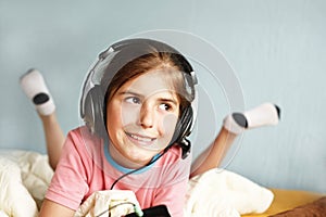 Smiling girl listens to music