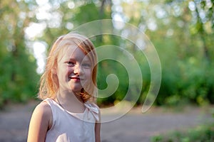 Smiling girl lit by the sun
