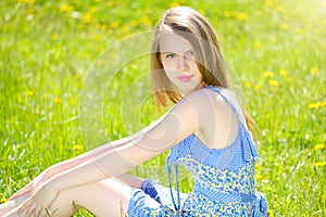 Smiling girl lying on the grass