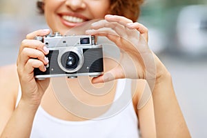 Smiling girl making photos
