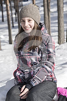 Smiling girl modeling in the snow