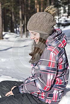 Smiling girl modeling in the snow