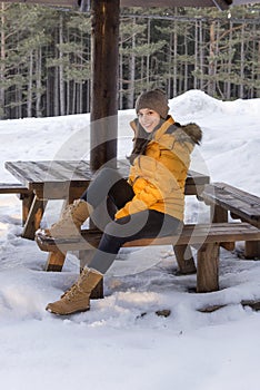 Smiling girl modeling in the snow