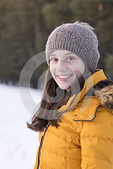 Smiling girl modeling in the snow