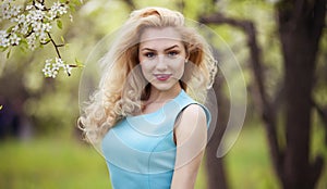 Smiling girl natural beauty, lovely female walking spring nature, portrait of young lovely woman in spring flowers