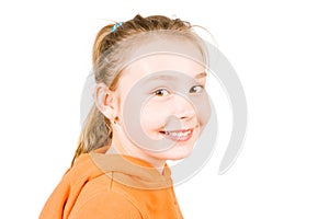 A smiling girl in orange