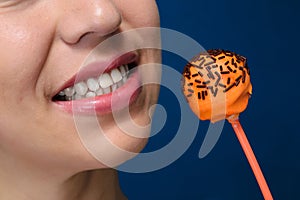 Smiling girl with orange cakepops