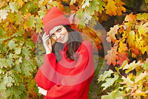 Smiling girl in the park. Autumn season.