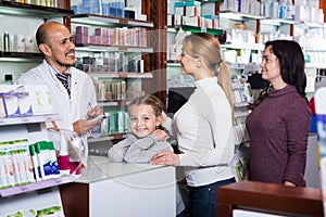 Smiling girl in a pharmacy