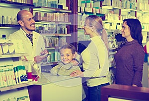 Smiling girl in a pharmacy