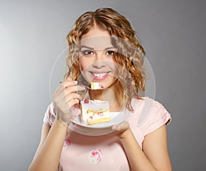 Smiling girl with piece of cake