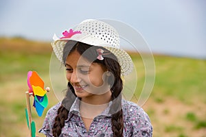 Smiling girl with pinwheel