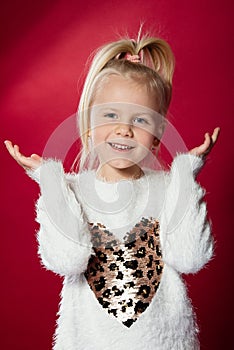 Smiling girl, portrait on  red background